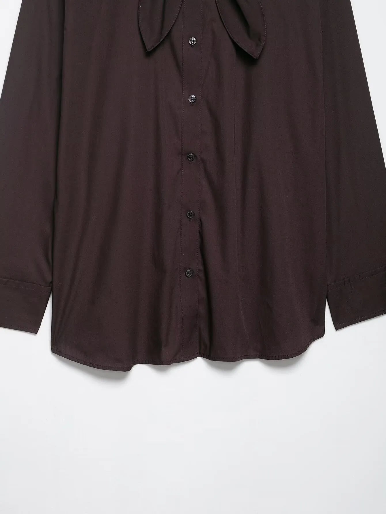 Brown loose-fit women's poplin shirt with long sleeves and a matching bow tie scarf, shown in a cardigan style.
