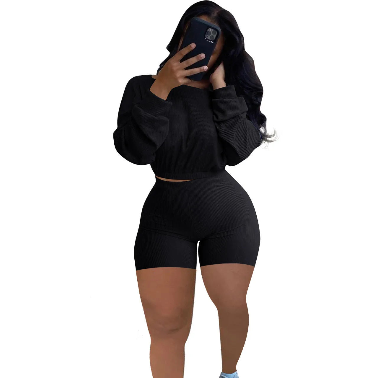 Women's off-the-shoulder long sleeve top and shorts two-piece set in a solid colour.