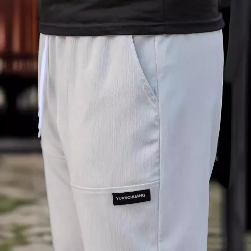 Men's polyester trousers in light grey, dark green, black, dark grey, dark blue colours for spring and autumn wear