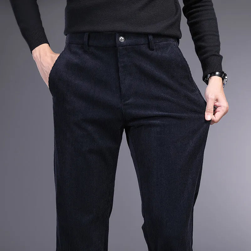 British retro striped straight-leg men's trousers in a dark colour, laid flat to show the zip fly and full length.