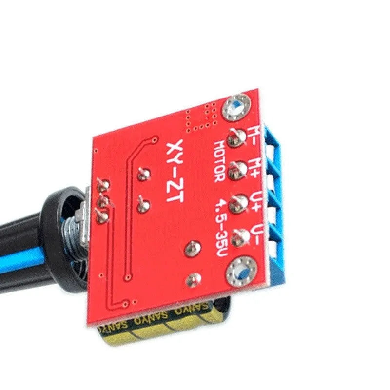 PWM DC motor speed governor module on a white background showing knob, terminals, and compact size.