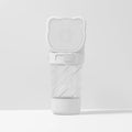 Green 3-in-1 pet water bottle with food container and waste bag dispenser for outdoor use