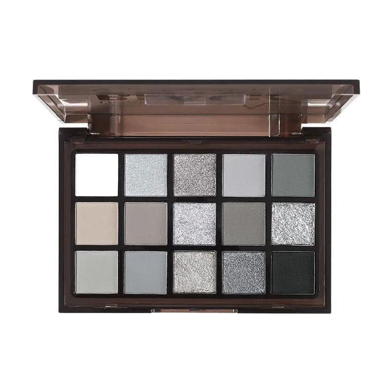 15-colour eyeshadow palette showing matte and shimmer shades including grey, black, brown, blue and earth tones