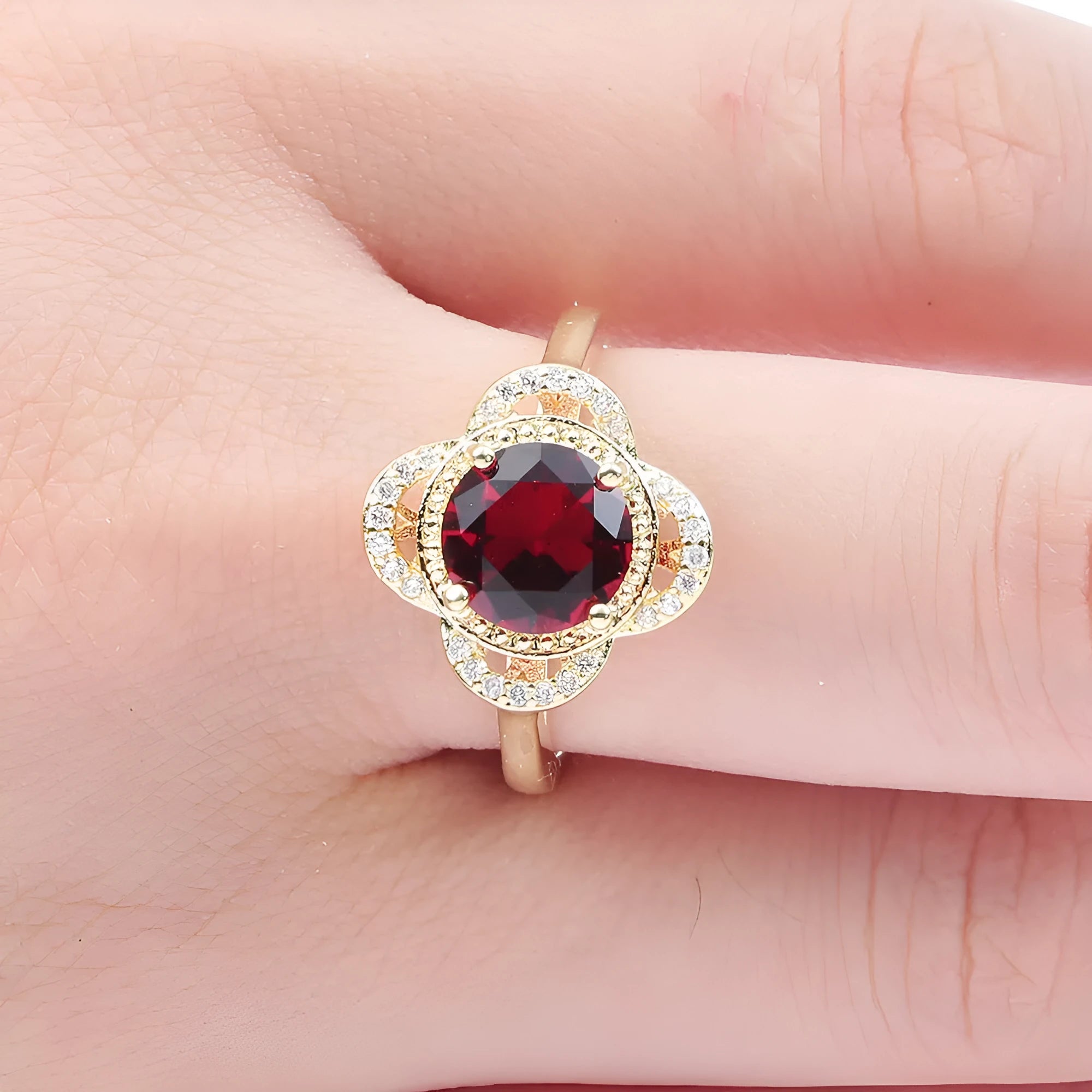 Copper ring with a fruit-shaped zircon stone inlaid, shown in UK size 7, 8, or 9.