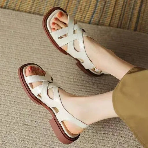 Women's patent leather square toe beach sandals in black with low heel and cross straps