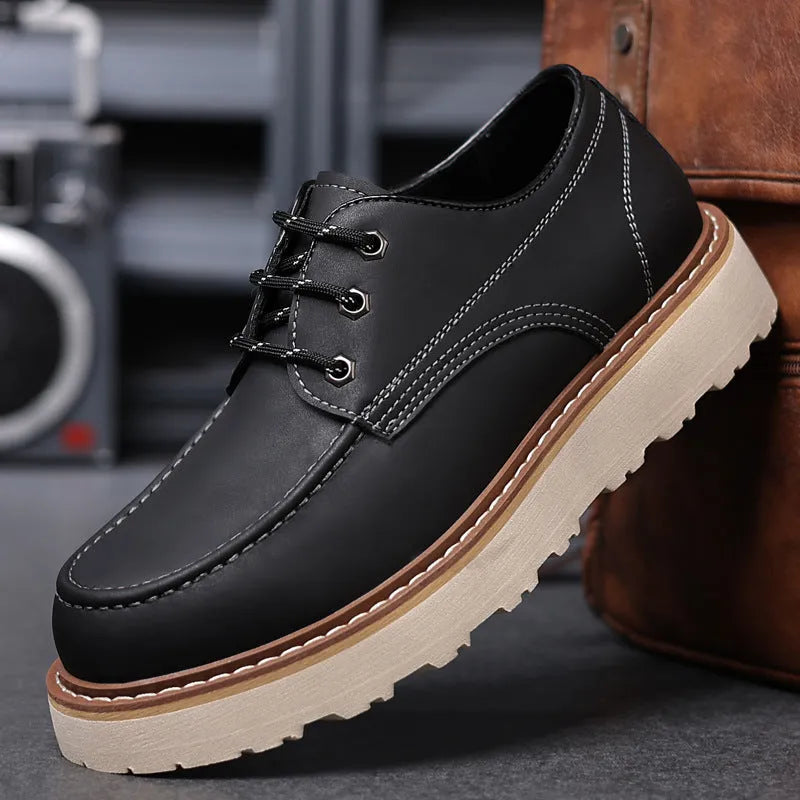 Men's black Martin boots with low-top retro design showing rubber sole and round toe shape