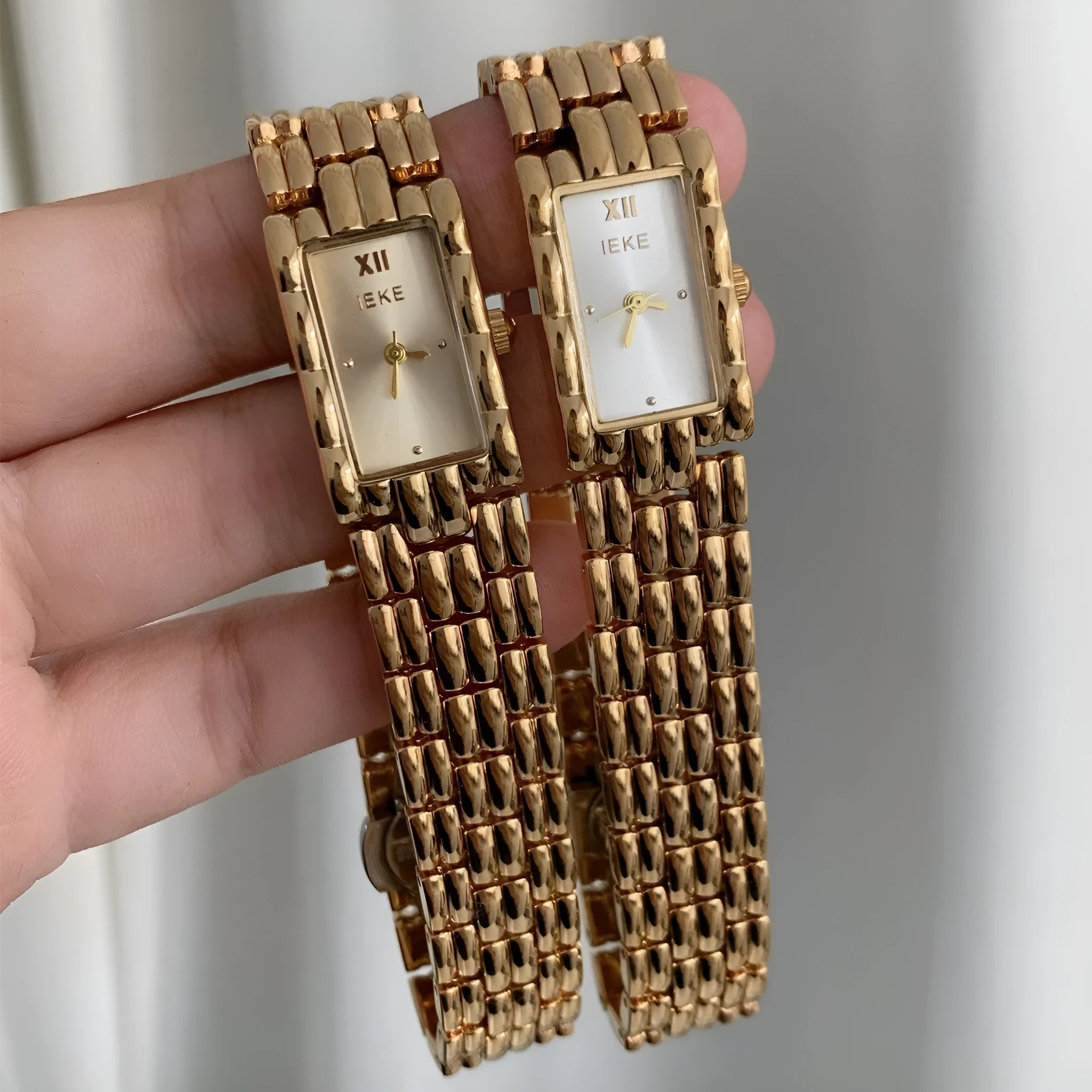 Women's silver and gold bracelet-style analogue watches with 15mm dials and butterfly clasps
