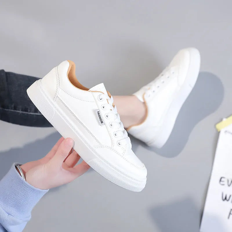 Low-top Korean-style sneakers in white or brown with artificial PU upper and plastic sole.