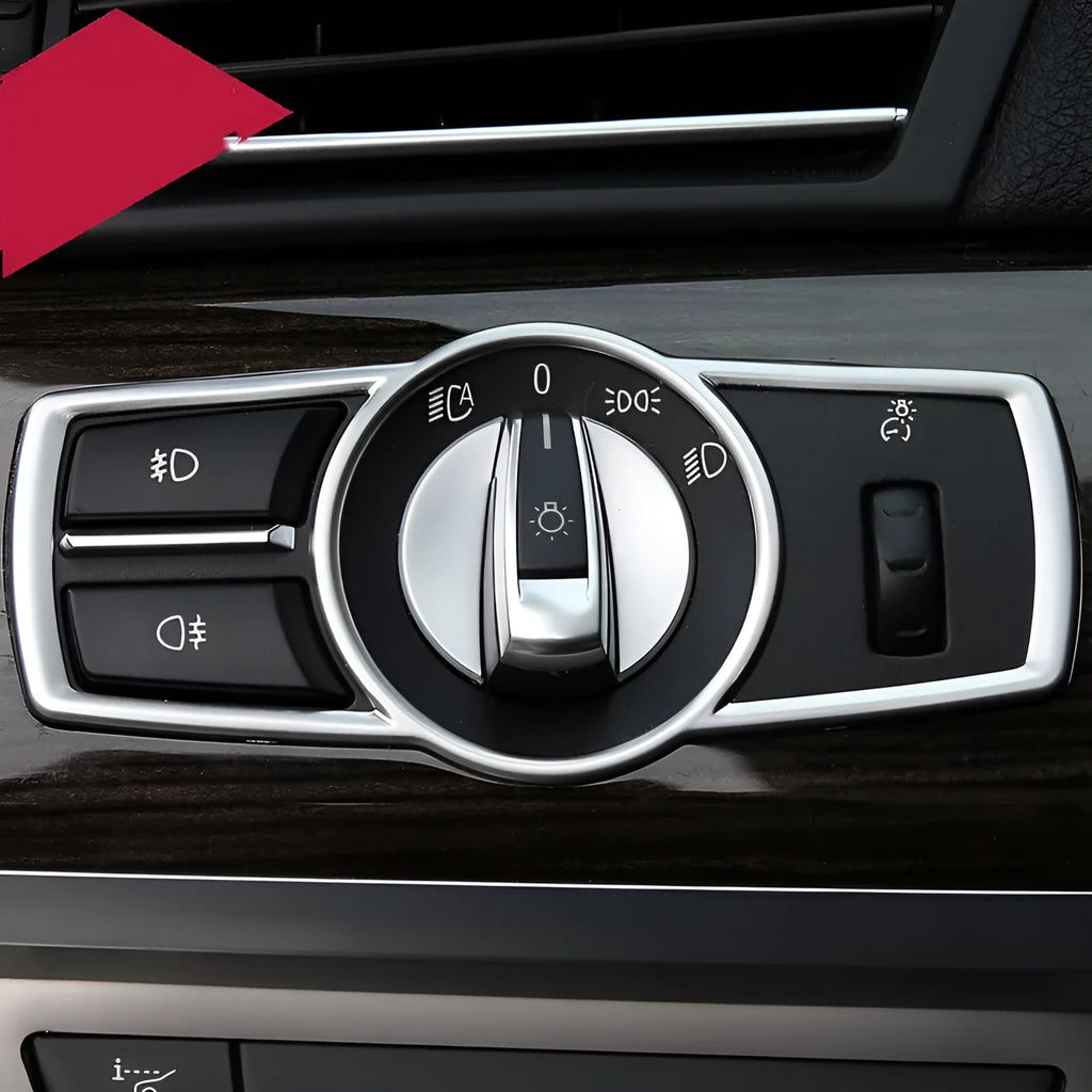 Silver ABS plastic decorative strip sticker for BMW headlight switch frame interior modification.