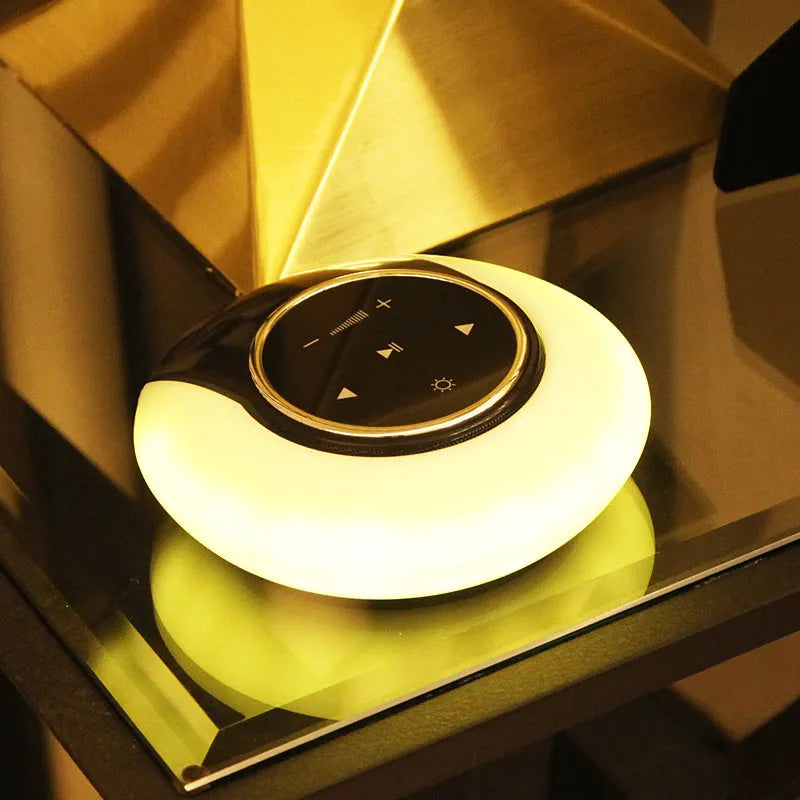 Blue folding Bluetooth desk lamp speaker with subwoofer and touch controls for adjustable LED lighting.