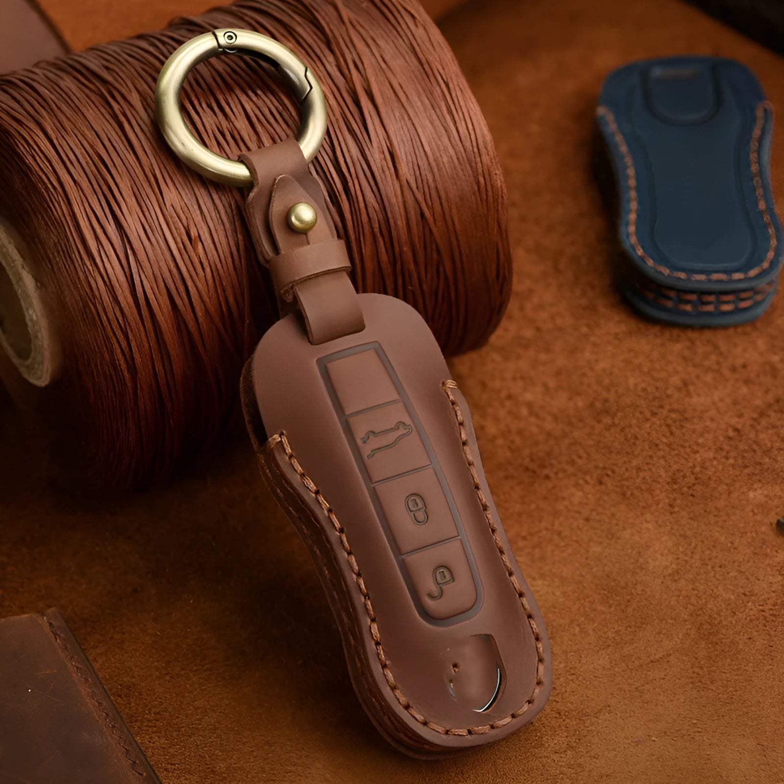Genuine cowhide leather Porsche key cover with retro bag buckle in blue or brown colour.