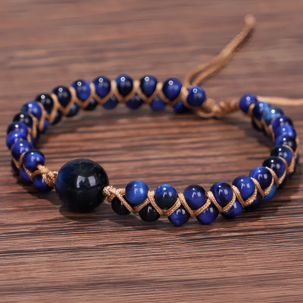 Hand-woven geometric bracelet made from tigereye stone with an adjustable sliding knot, shown in blue colour