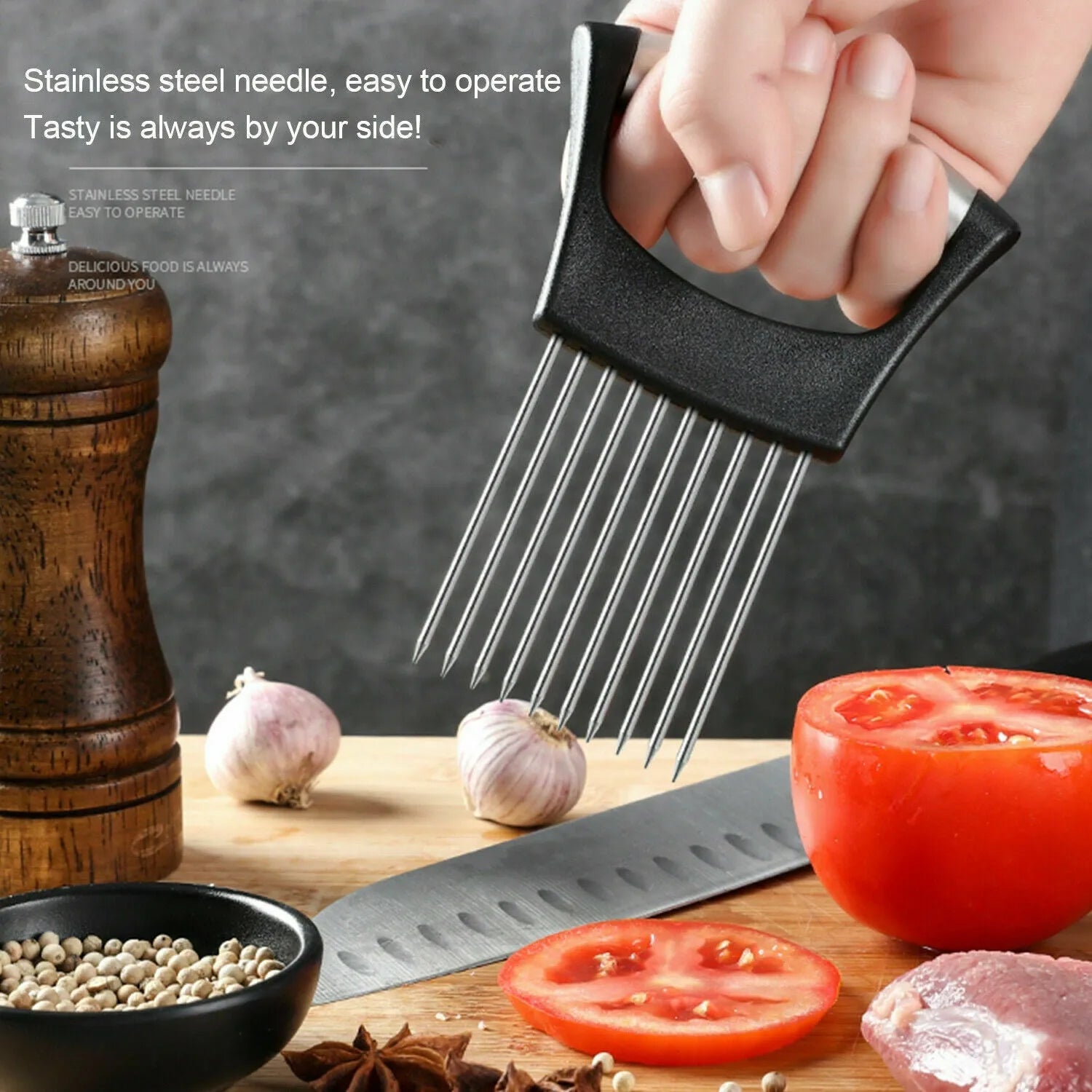 Stainless steel and ABS onion holder slicer for securing tomatoes and vegetables during cutting.