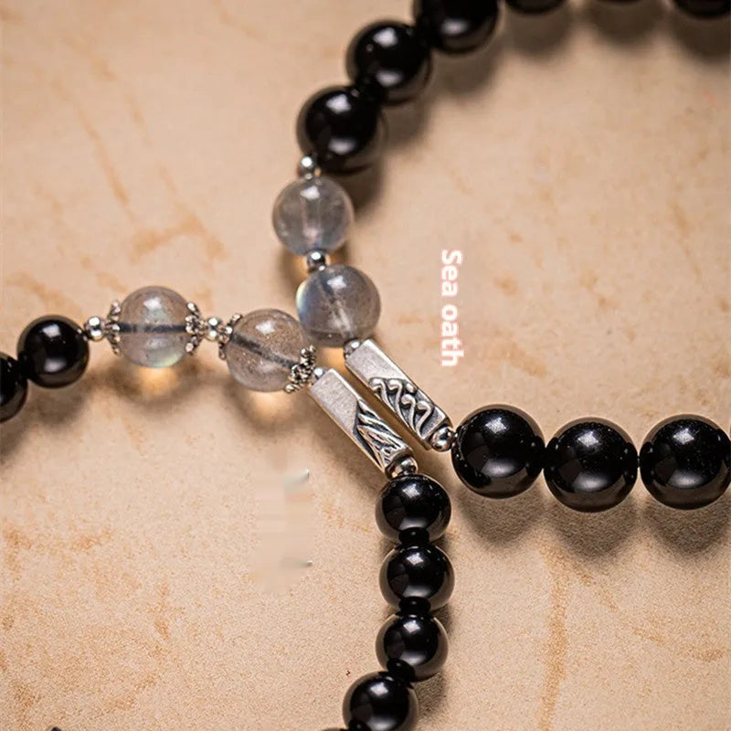 Obsidian Buddha beads couple bracelet DIY kit showing 8mm and 10mm beads with stringing materials