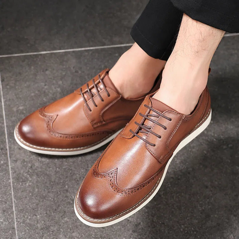 Men's black and brown slip-on business casual shoes with round toe and low top.