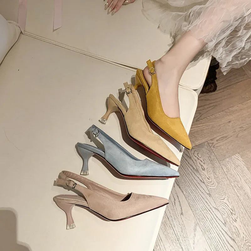 A pair of apricot-coloured suede pointed-toe stiletto high heels with a rubber sole.