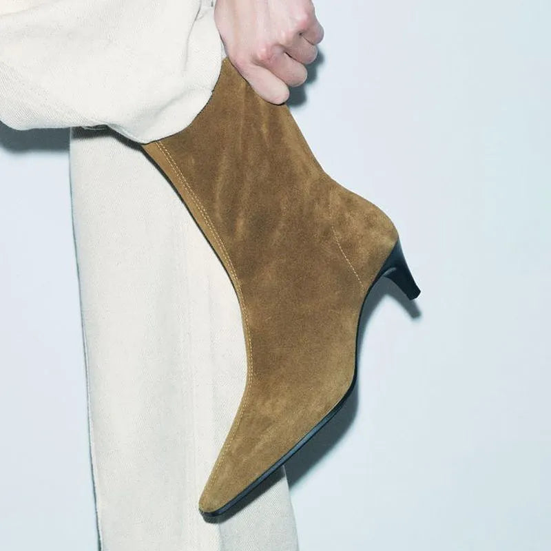 Brown women's square toe ankle boots with a side zip and mid kitten heel on a waterproof platform sole.