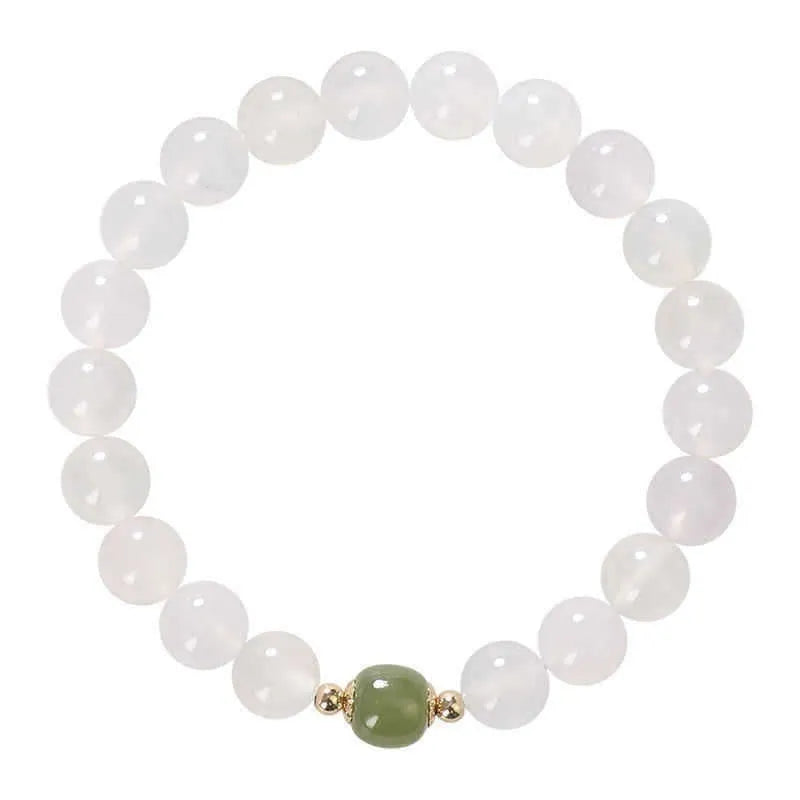 Handmade white agate and crystal bracelet with cinnabar inlay, showing 6mm or 8mm bead size.