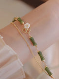 Handmade natural olivine bracelet with double layer Twin Bells of Ireland design and olive branch elements