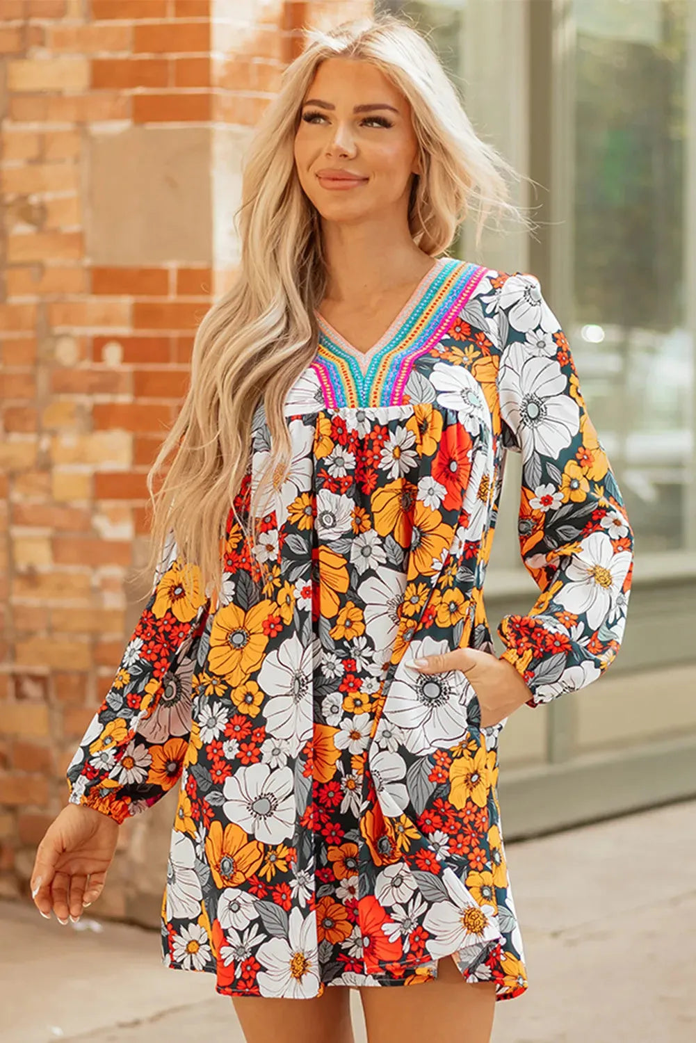Orange floral striped lace V-neck long sleeve mini dress on hanger