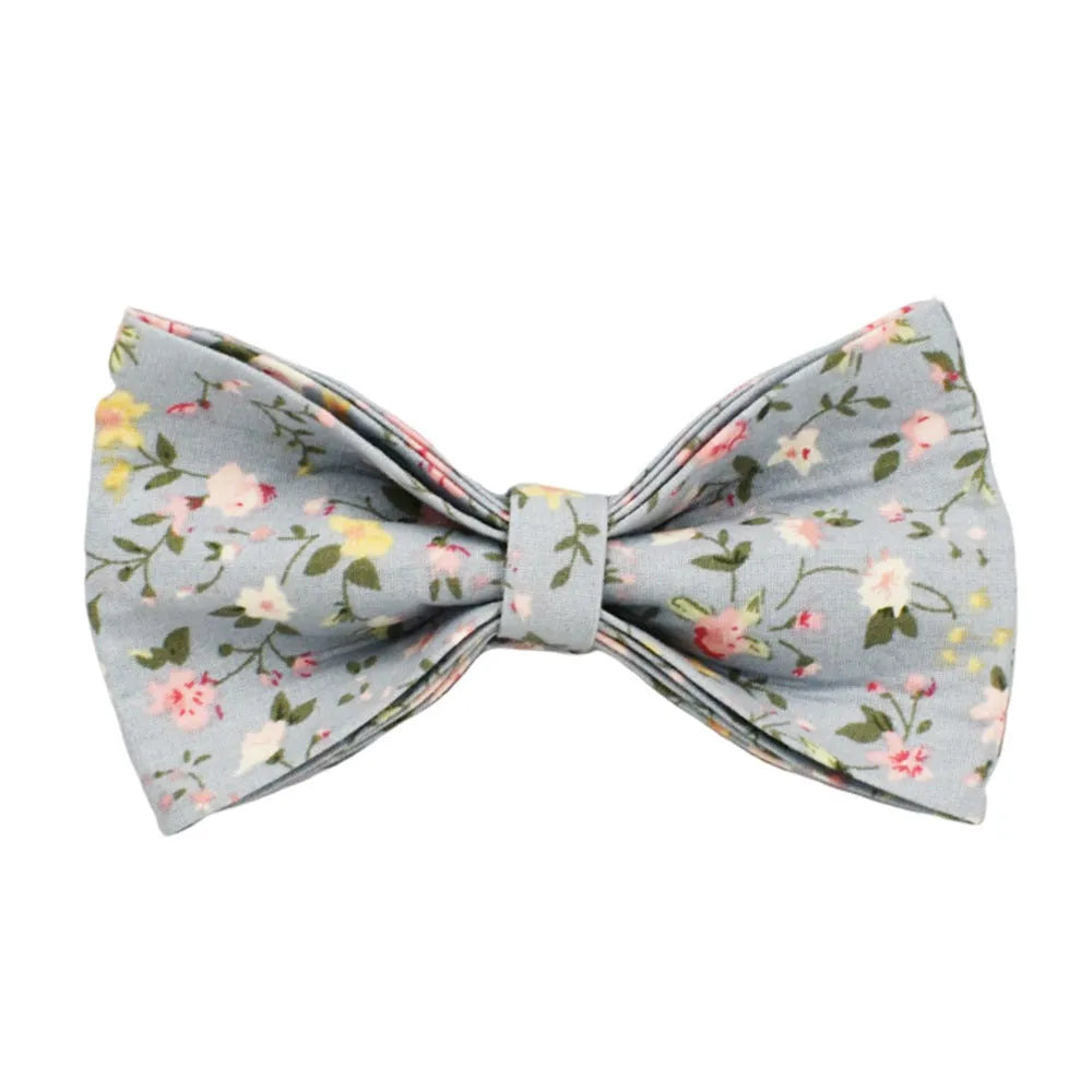Blue floral patterned cloth dog collar set with matching leash, bow, and vest for small to extra-large dogs.