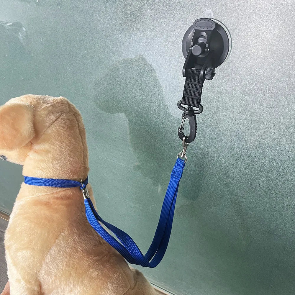 Black and blue pet bathing restraint with suction cup, rope, and anti-grab handcuffs shown in small and large sizes.