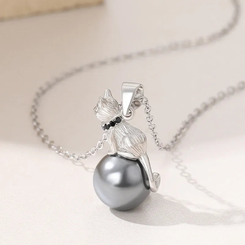 925 sterling silver cat pendant necklace with electroplated finish on model