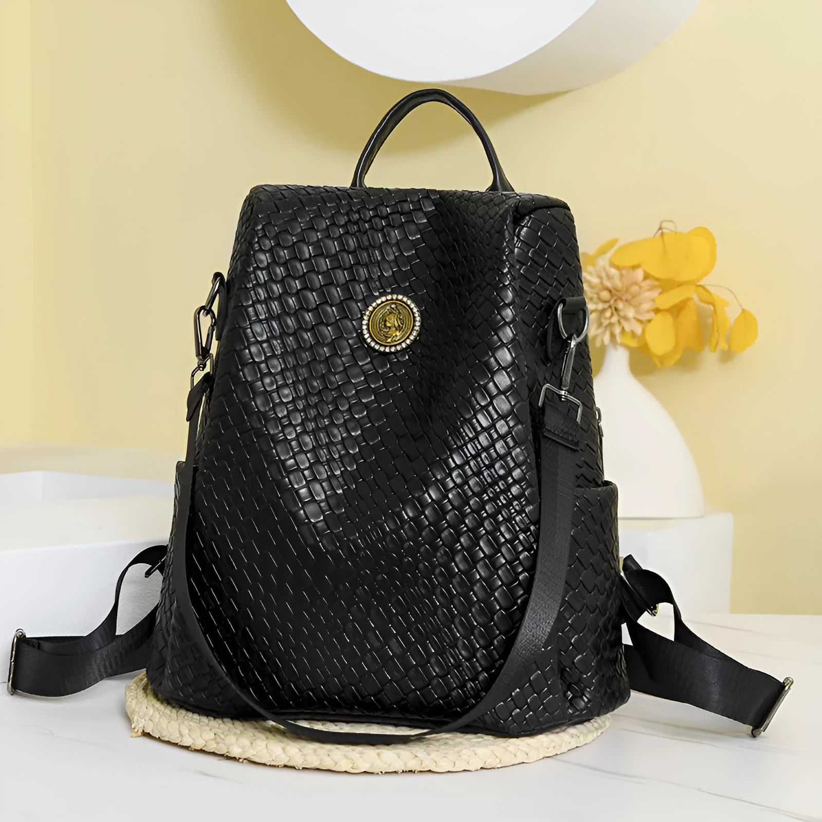 Women's black anti-theft backpack with weaving detail and organisational compartments