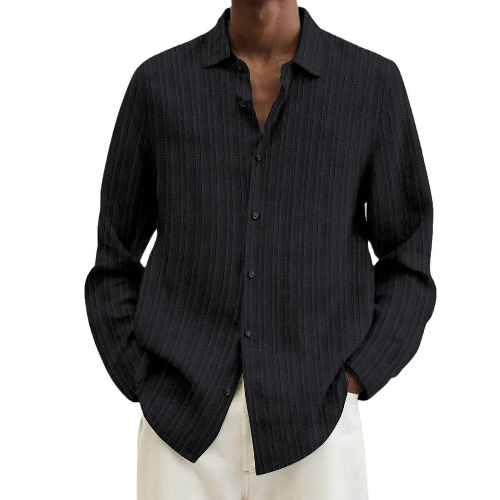 Man wearing a loose-fit, striped, long-sleeve cardigan in a blue colour variant