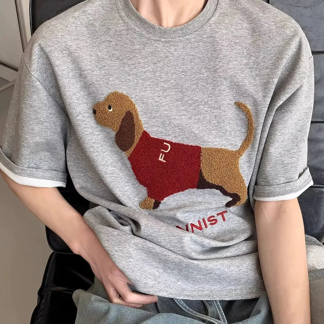 Men's grey T-shirt with embroidered sausage dog towel design on front, short sleeves and round neck