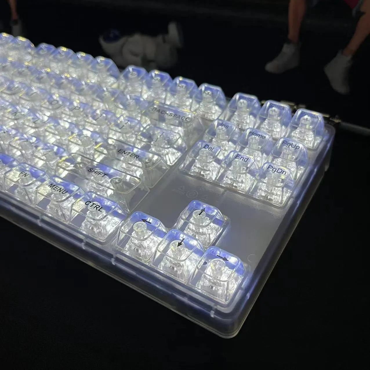 132 transparent plastic mechanical keyboard key caps laid out in grid pattern