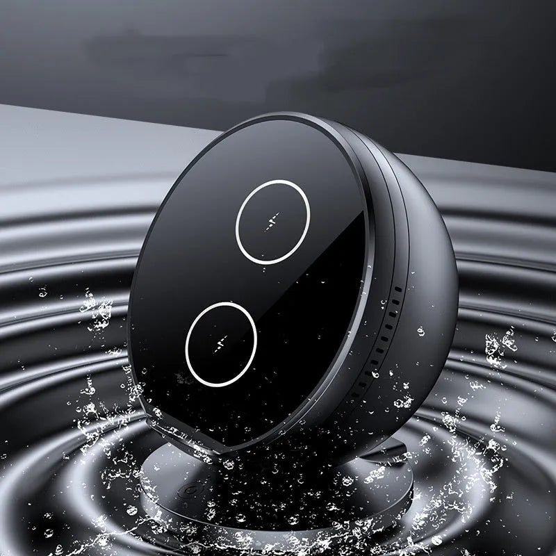 XC-11 black mobile phone wireless charger holder with integrated Bluetooth speaker on a desk.