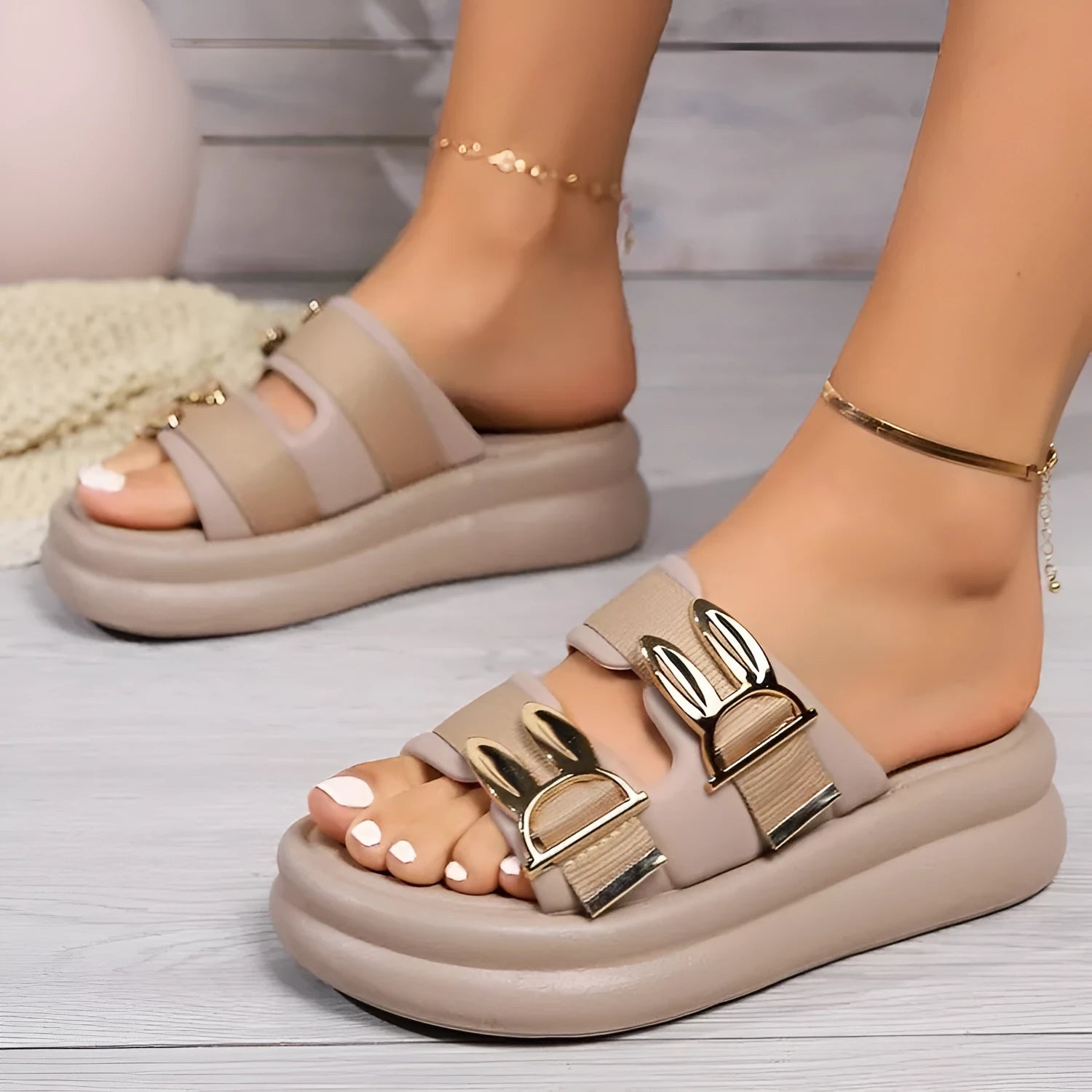 Women's suede upper slippers with thick rubber sole in apricot, black, and off white colours.