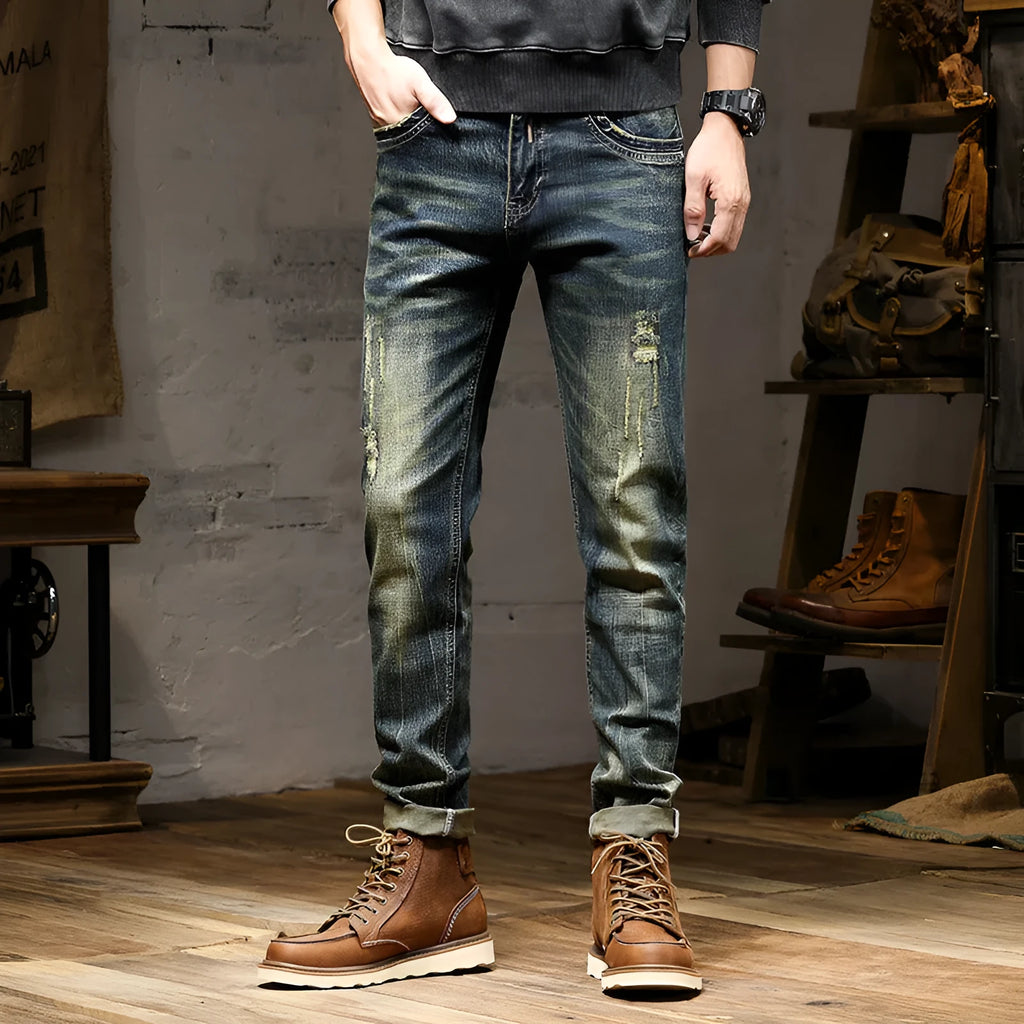 Man wearing retro blue skinny fit stretch denim jeans with a zip fly.
