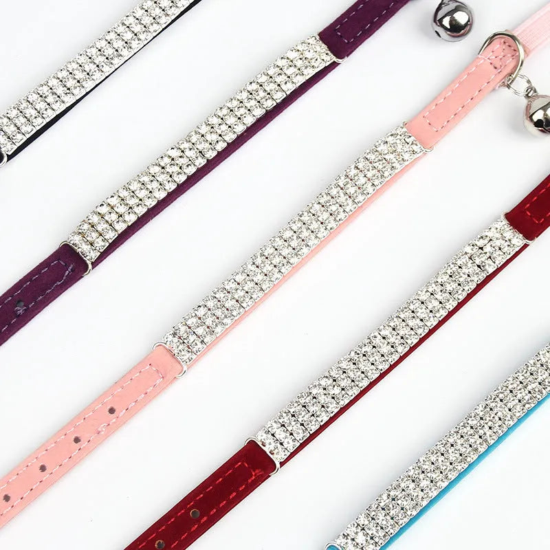 Soft red velvet cat collar with rhinestones, shown adjusted to fit