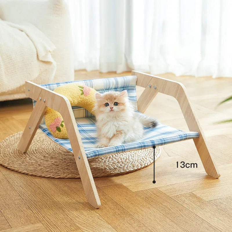 Wooden frame cat hammock bed with blue cloth fabric, elevated design for indoor cats.