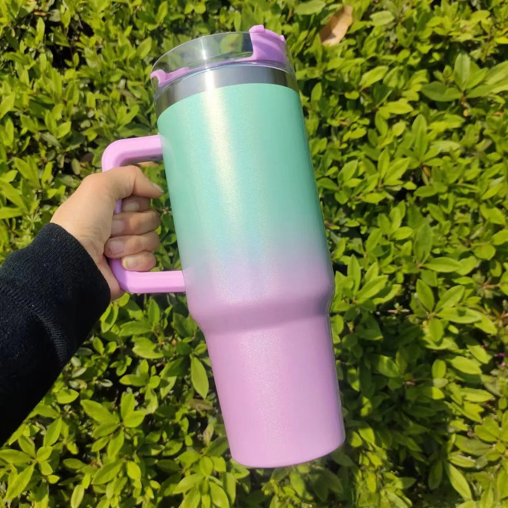 Large stainless steel vacuum insulation cup in a rainbow colour or gradient finish, showing its tall 27.5 cm height and wide 10 cm opening.