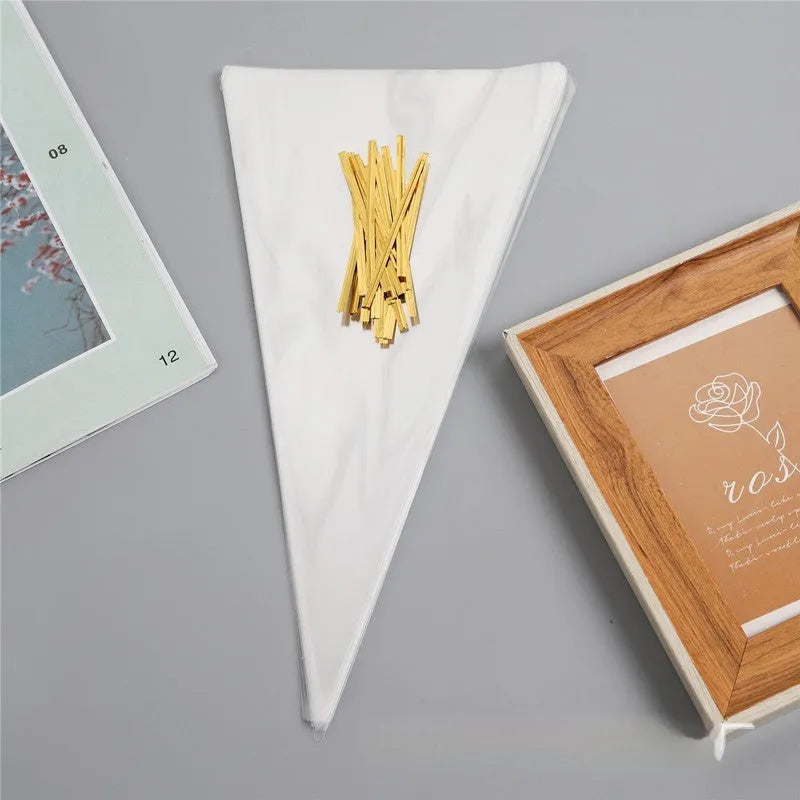 Clear triangular OPP plastic packaging bag with a twisted wire seal, shown next to a pack of bags.