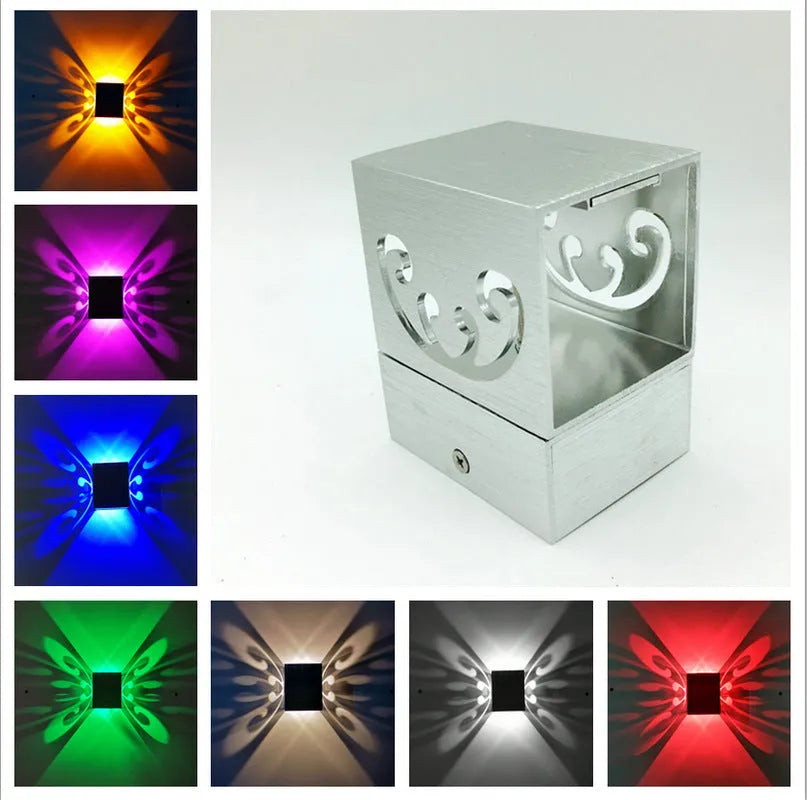 Modern butterfly-shaped aluminium LED wall lamp with colour-changing remote.