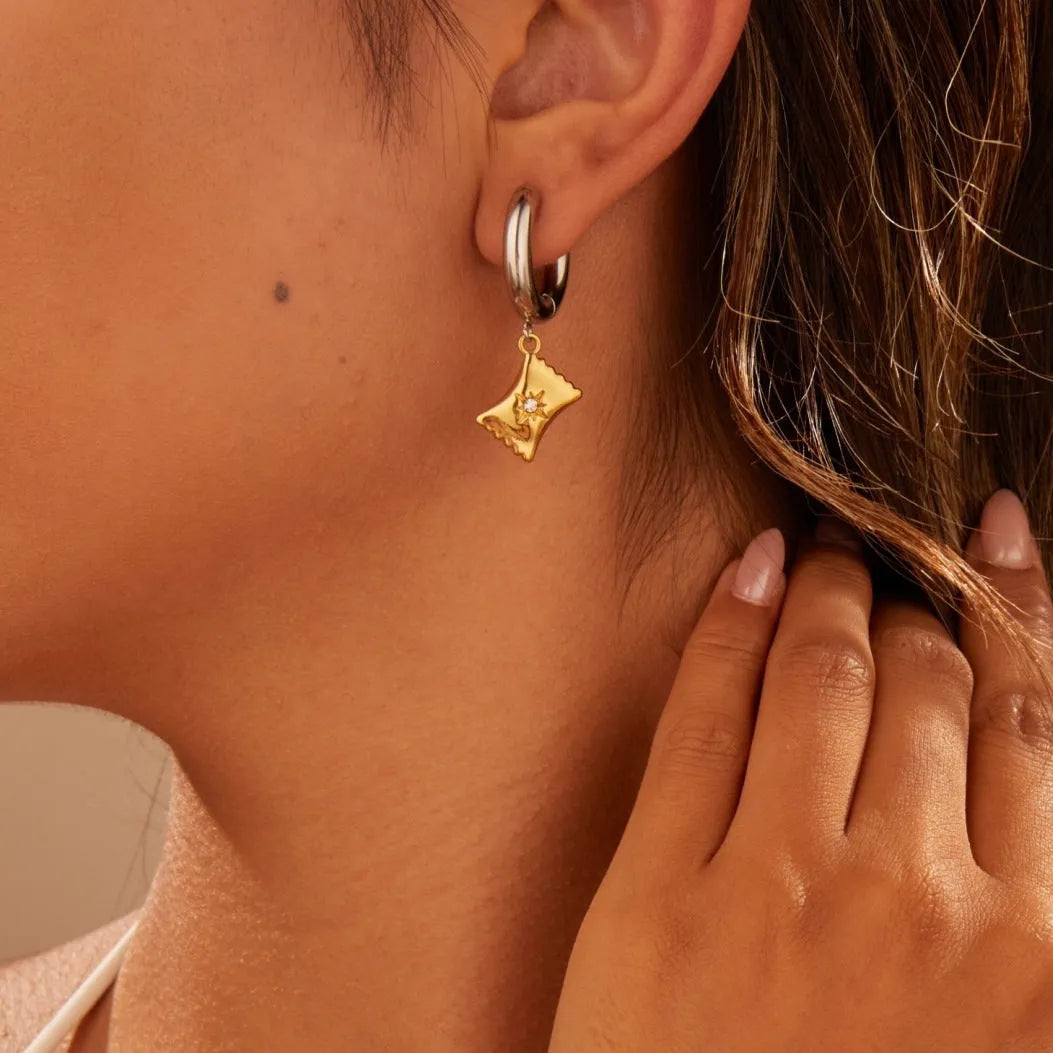Women's stainless steel Christmas tree earrings with 18K electroplated finish showing heart and star shapes
