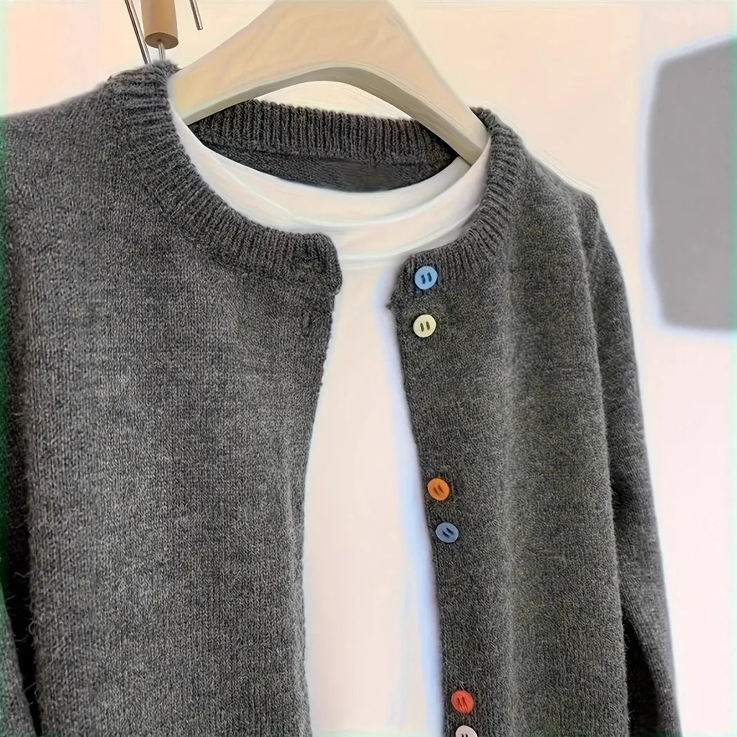 Dark grey women's polyester cardigan sweater with button front and long sleeves laid flat.