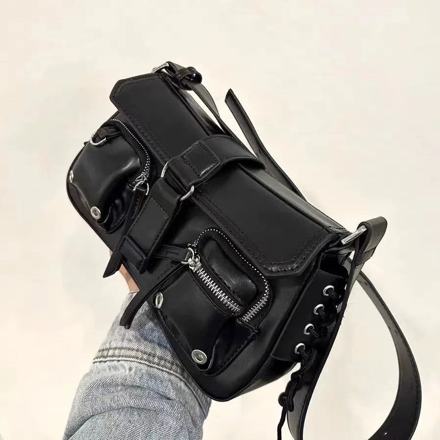 Black PU leather underarm baguette bag with an adjustable long strap.