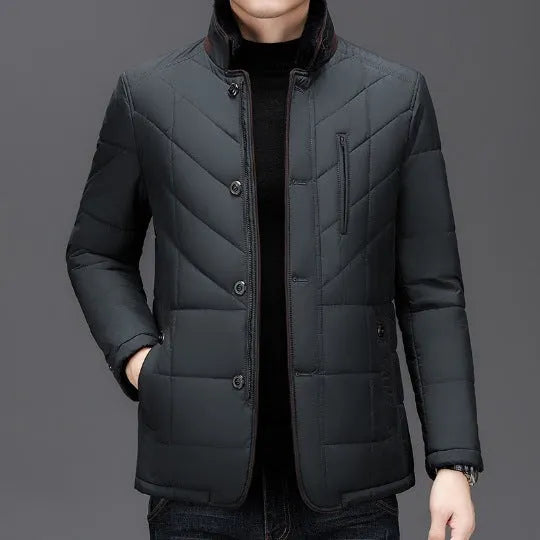 Dark blue men's short-length cotton-padded winter coat with side seam pockets on a hanger.