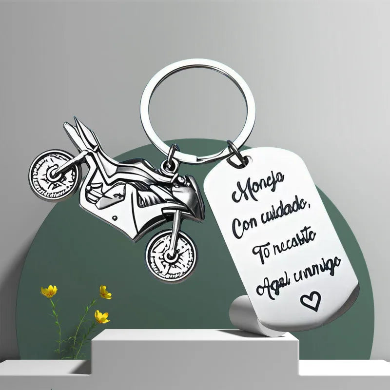 Stainless steel motorcycle keychain with modern design and included flannel bag.