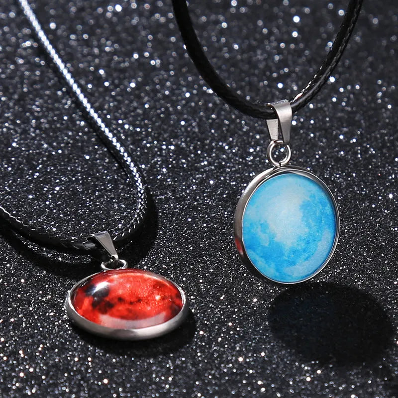 Close-up of a luminous constellation model glass pendant on an alloy necklace chain with extension.