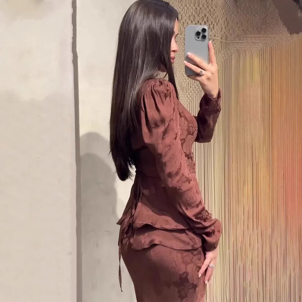 Dark brown artistic retro dress with floral pattern, long sleeves, and slim fit silhouette