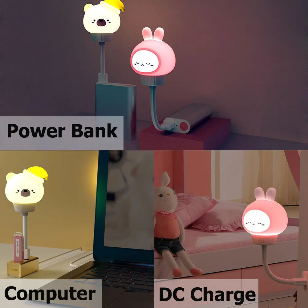 White cartoon bear-shaped USB night light with remote control on a wooden table.