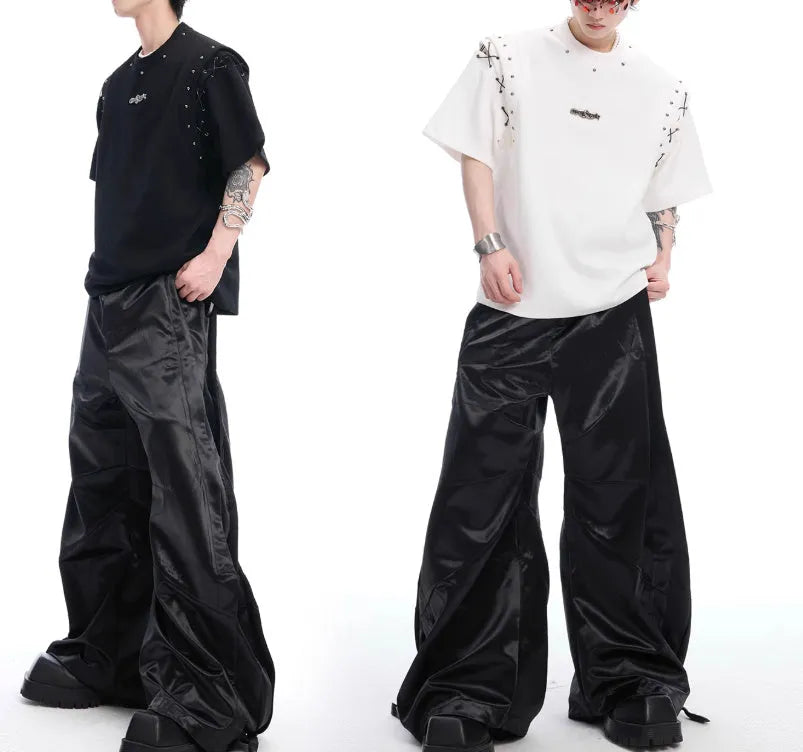 Deconstruction style short sleeve T-shirt with lace-up cutout detailing in black.