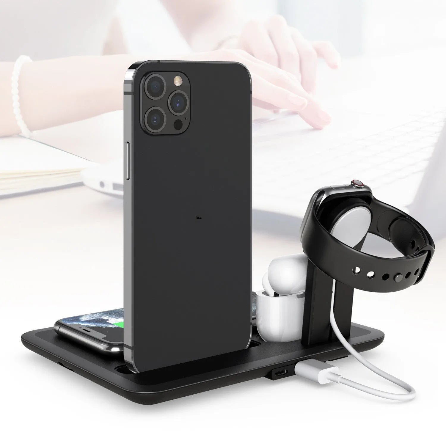 Desktop wireless phone charger with watch and headphone charging outputs in black or white