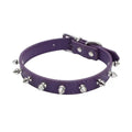 A spiked dog collar made of thickened black PU leather with a metal alloy buckle and silver studs.